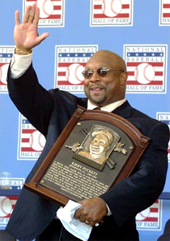 Kirby Puckett holding his Hall of Fame Plaque at the induction ceremony in Cooperstown.